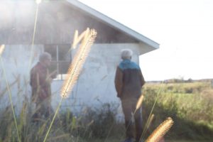 Joe Chase and Peter Klein observe the surrounding of the Thompson-Schneider house