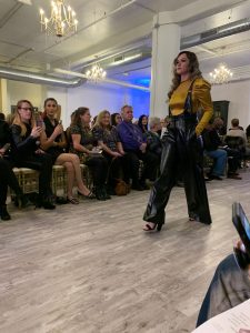 A model walks down the runway at Milwaukee fashion week