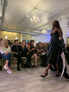 A model walks down the runway at Milwaukee fashion week