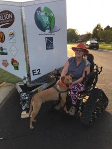 Spaeni sitting with her dog.