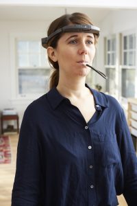 A woman demonstrates the BrainPort Vision Pro